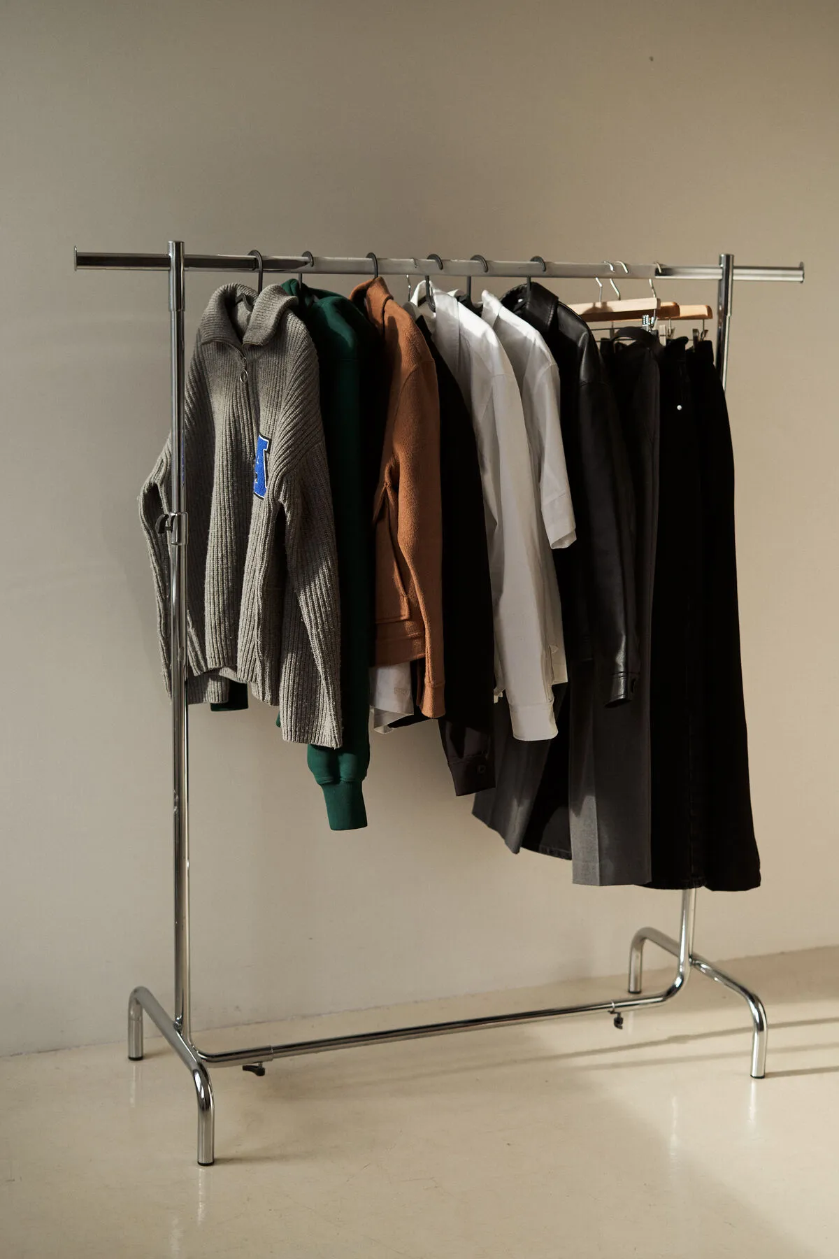 Assorted clothes on a minimalist rack